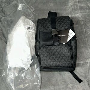 Michael Kors Cooper Sling Pack Backpack MK Black. PVC with Silver hardware.